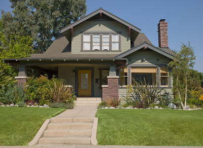 A large house with a front lawn.