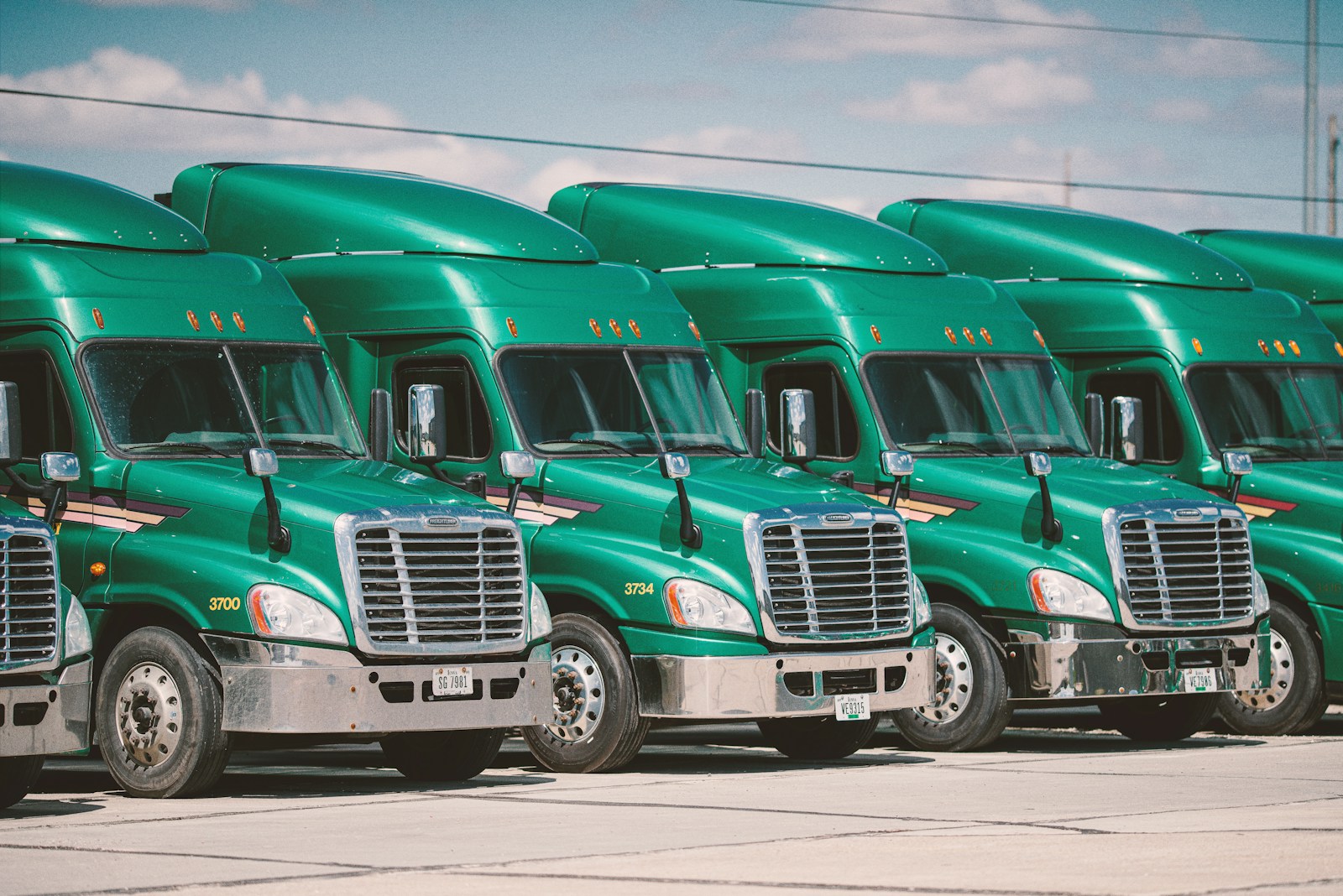 green and white vintage trucks with commercial auto policy